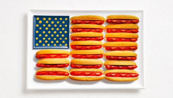 United States of America’s flag made from hot dogs, ketchup, and mustard or cheese.